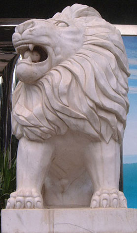 Western-influenced stone lion in Haikou (male) - frontal view