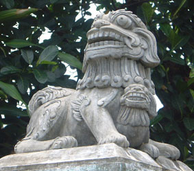 Guardian lion in Hue, Vietnam (female)