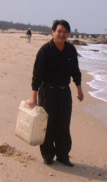 A man with a plastic petrol tank